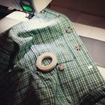 Use washable wonder tape to anchor buttons before sewing them on by machine! #sewing #isew